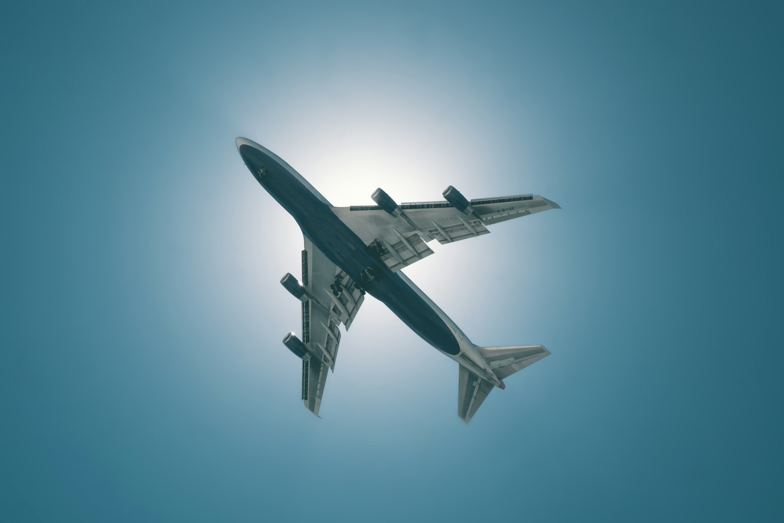 Airplane approaching JFK Airport at sunset over Rockaway Beach